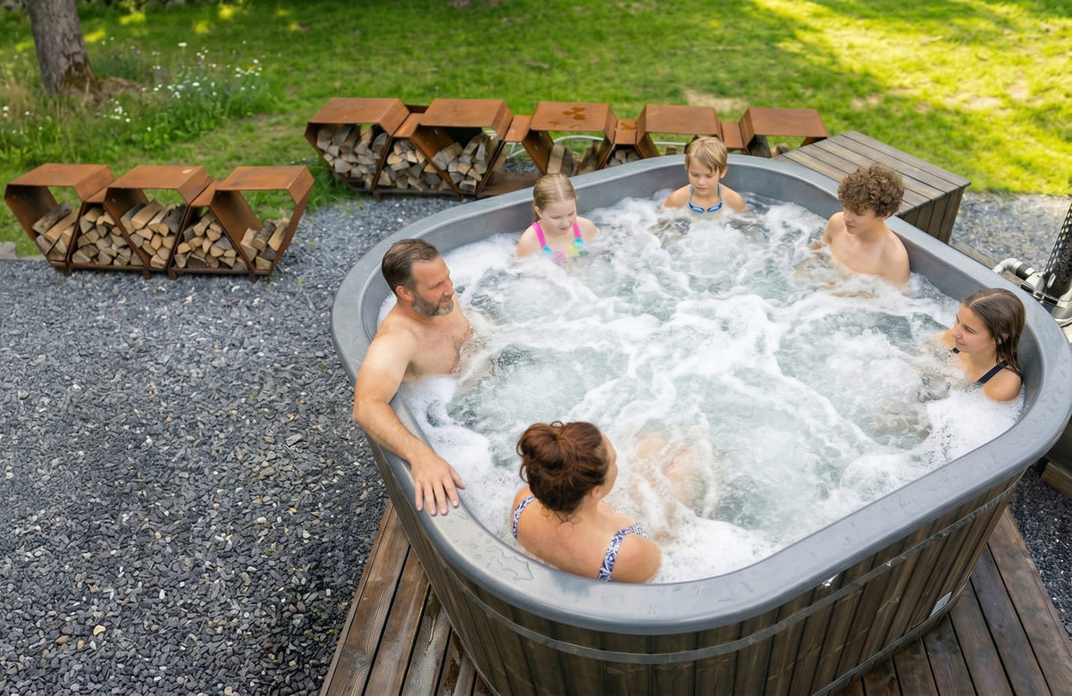 Family enjoying a hot tub outdoors with a wooden fire pit in the background