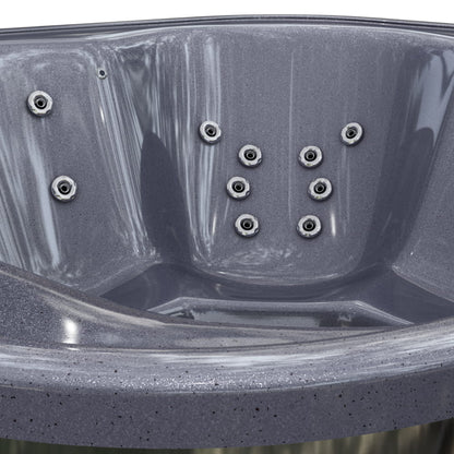 Close-up of a grey hot tub with hydro massage jets.